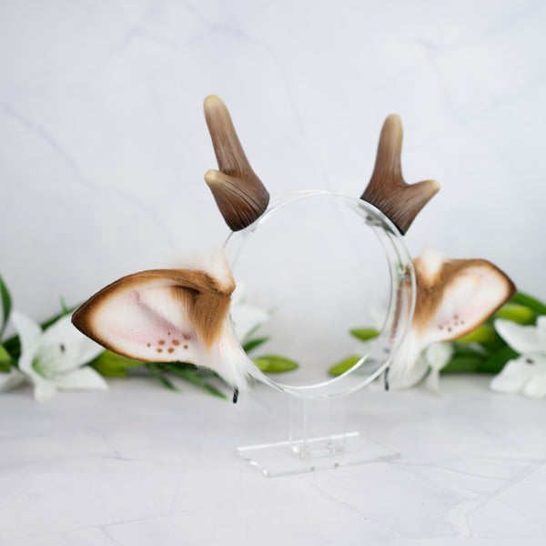Spotted deer ears with antlers