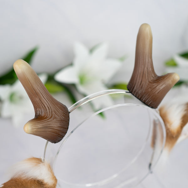 Spotted deer ears with antlers