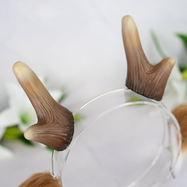 Brown deer ears with antlers