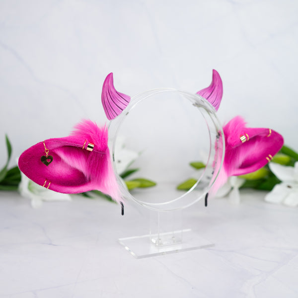 Pink cow ears with Piercings
