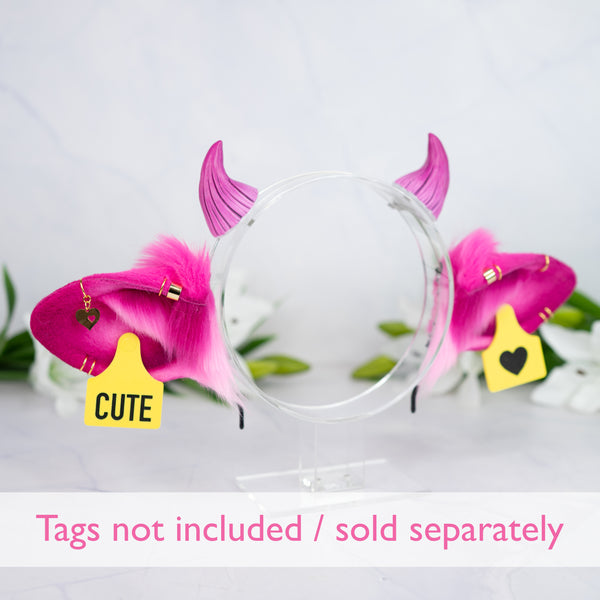 Pink cow ears with Piercings