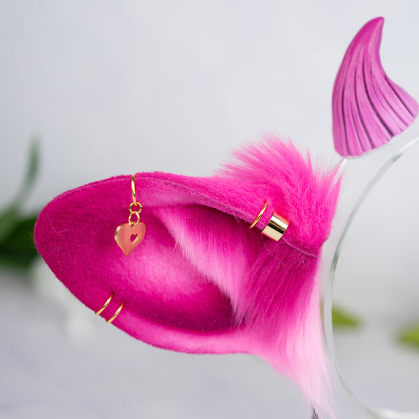 Pink cow ears with Piercings