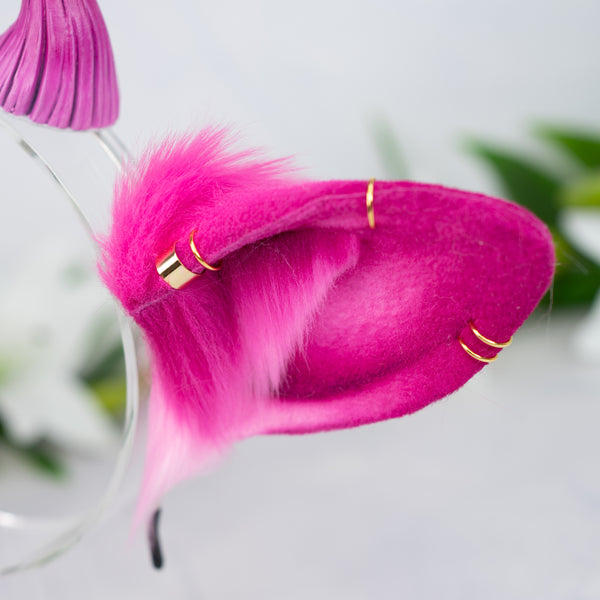 Pink cow ears with Piercings