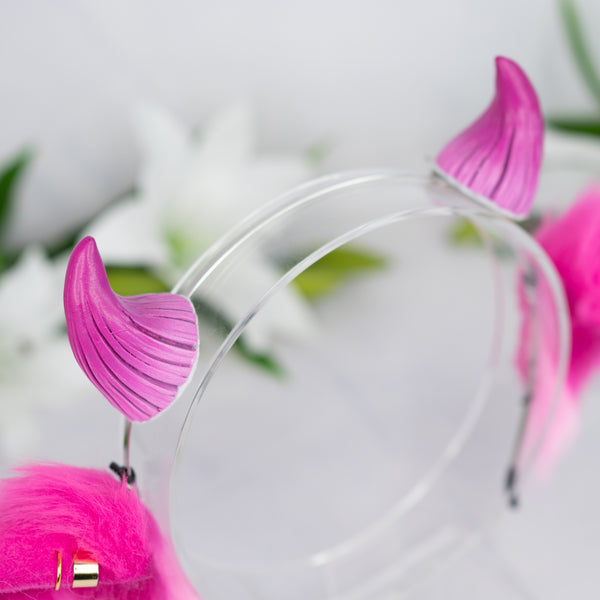 Pink cow ears with Piercings