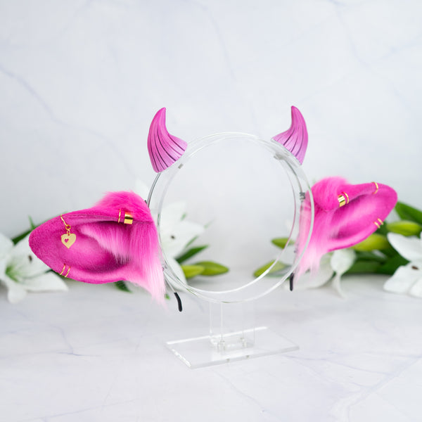 Pink cow ears with Piercings