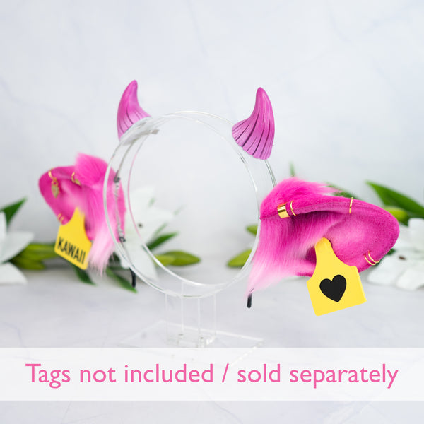 Pink cow ears with Piercings