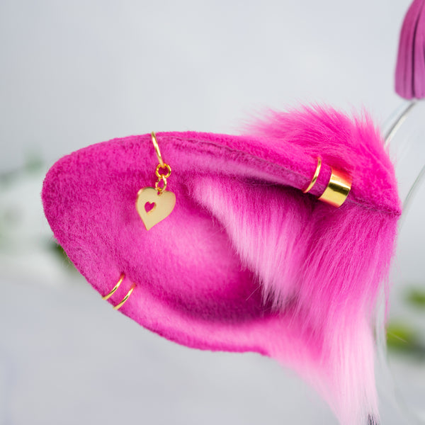 Pink cow ears with Piercings