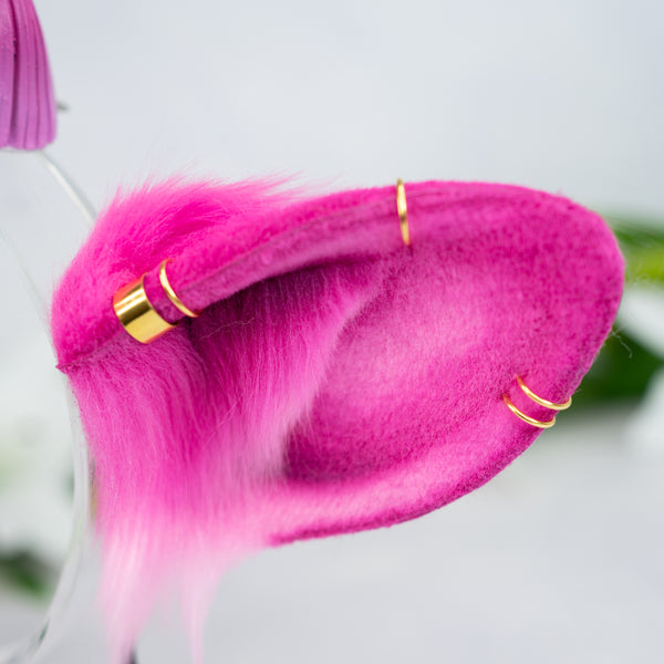Pink cow ears with Piercings